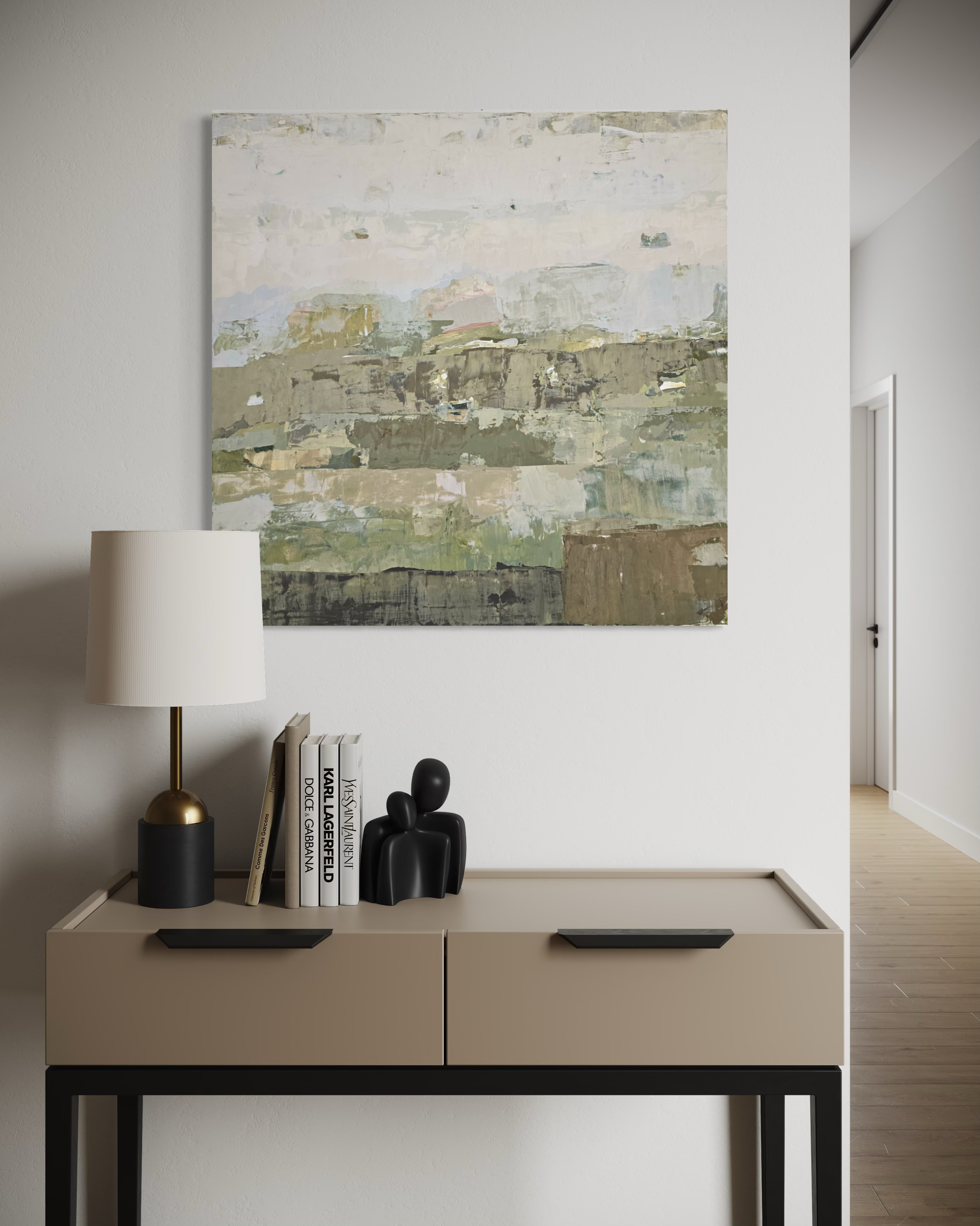 An abstract canvas wall art created by Birute Studio with textured layers in muted green, beige, gray, and white, displayed in a modern home interior above a beige console table with a lamp and books.